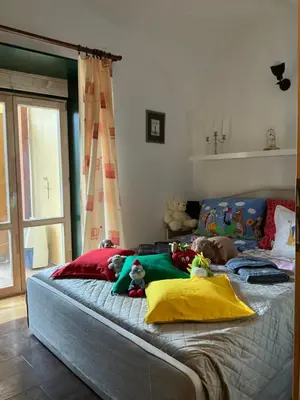 a bed with stuffed animals on it in a bedroom at Apartmány na Náměstí in Český Brod