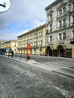 an empty street in a city with buildings at Valentinka Minutes away from Charles Bridge in Prague