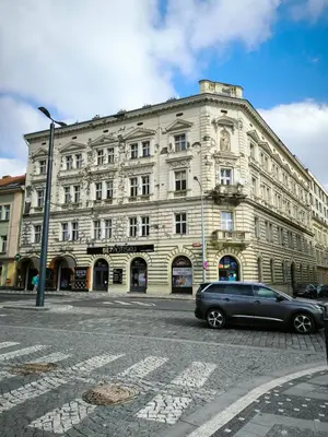 a car parked in front of a large building at Valentinka Minutes away from Charles Bridge in Prague