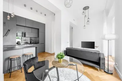 a living room with a couch and a table at Luxury apartment in the center in Prague