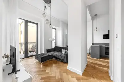 a living room with a couch and a table at Luxury apartment in the center in Prague