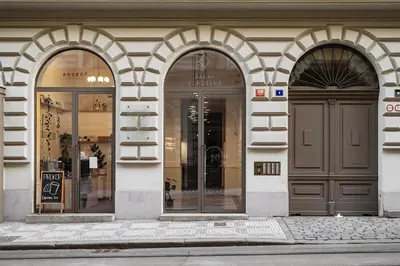 a building with three arched windows and a door at Luxury apartment in the center in Prague