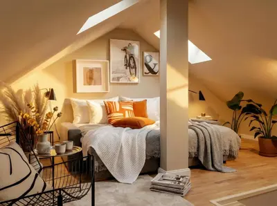 a room with a bed with orange and white pillows at TurnKey I Karlín Square Apartments in Prague