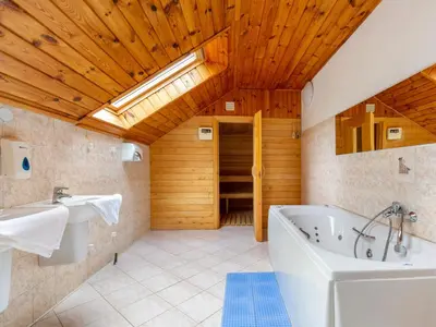 a bathroom with a tub and a sink at Holiday Home Malovidy by Interhome in Rataje nad Sázavou