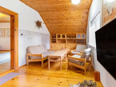 a living room with a table and chairs at Holiday Home Malovidy by Interhome in Rataje nad Sázavou