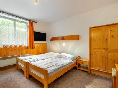 a bedroom with a bed and a window at Holiday Home Malovidy by Interhome in Rataje nad Sázavou