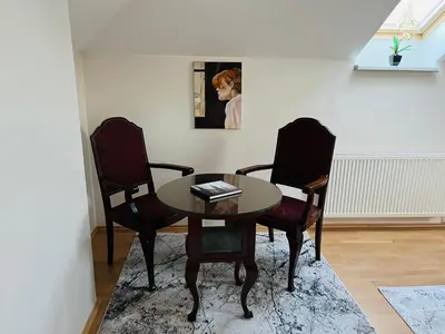 a dining room with a table and two chairs at Harrison Homes Prague Apartment 02 Terrace and Parking in Prague