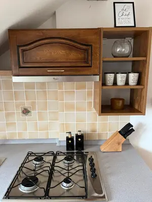 a kitchen with a stove top oven in a kitchen at Harrison Homes Prague Apartment 02 Terrace and Parking in Prague