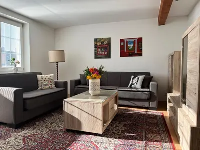 a living room with two couches and a tv at Harrison Homes Prague Apartment 02 Terrace and Parking in Prague