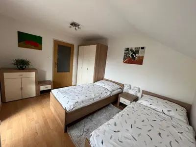 a bedroom with two beds in a room at Harrison Homes Prague Apartment 02 Terrace and Parking in Prague