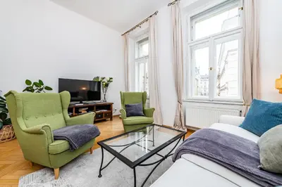 a living room with a couch and a tv at Quiet apartment in the Old Town in Prague