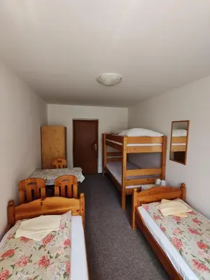 a room with three beds and two bunk beds at Pension Trojská in Prague