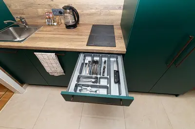 a kitchen with a sink and a counter with a drawer at LUX PRAHA in Prague