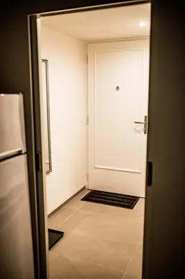 a door leading into a room with a white door at Fritscher Apartments, s.r.o. in Prague