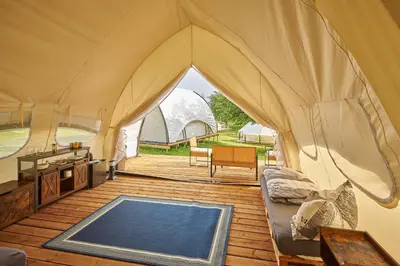 a tent with a pool in the middle of it at Glamping Slapy in Slapy