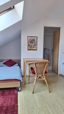 a wooden cabinet in the corner of a room at Pension Egida in Řež