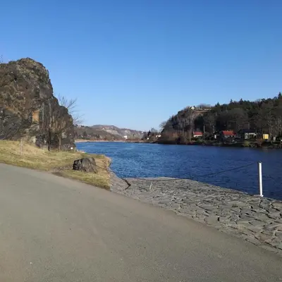 a road next to a body of water at Pension Egida in Řež