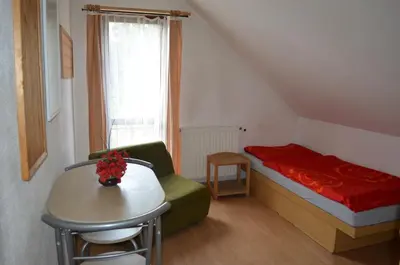 a kitchen with a sink and a stove top oven at Pension Egida in Řež