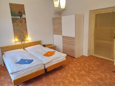 a bedroom with a bed with two towels on it at Pension 21 in Prague