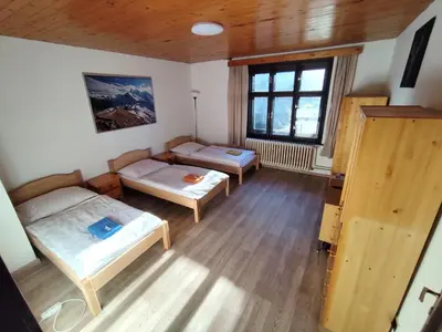 a room with two beds and a window at Pension 21 in Prague