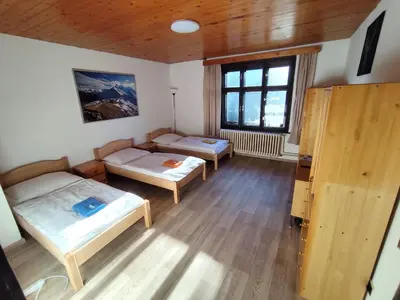 a room with two beds and a window at Pension 21 in Prague