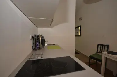 a kitchen with a sink and a counter top at Beautiful Apartments in Prague in Prague