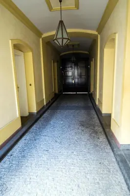 an empty hallway of a house with a ceiling at National Theater Ruterra Flat in Prague