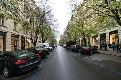 a street with cars parked on the side of the road at Luxurious two-bedroom in the Old Town in Prague