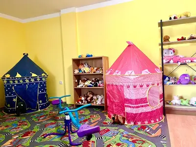 two play tents in a room with toys on the floor at Ubytování na venkově Církvice in Zásmuky