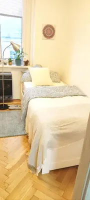 a bedroom with two beds and a window at Warm room in the beautiful Smíchov - Prague in Prague