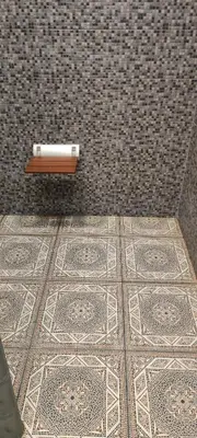 a candle on a tiled floor in a bathroom at Warm room in the beautiful Smíchov - Prague in Prague