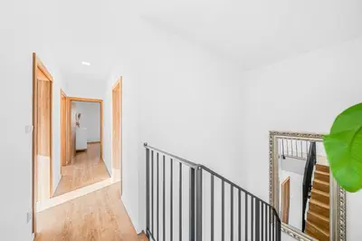 a hallway with a staircase in a house at Dům u Prokopského údolí in Prague