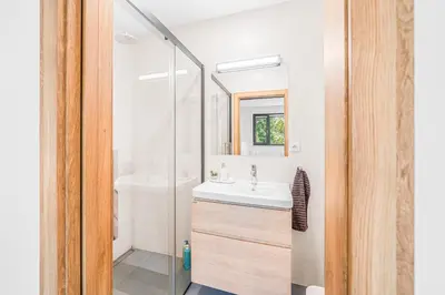 a bathroom with a sink and a mirror at Dům u Prokopského údolí in Prague