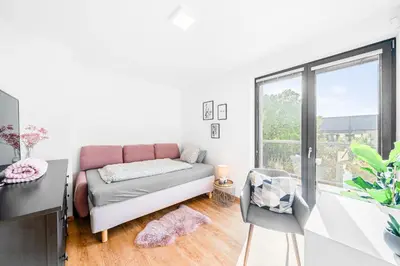 a living room with a couch and a window at Dům u Prokopského údolí in Prague