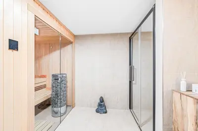 a shower with a glass door in a bathroom at Dům u Prokopského údolí in Prague