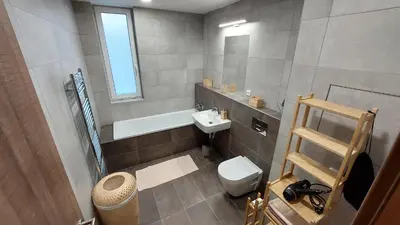 a small bathroom with a toilet and a sink at Apartmán Trilobit in Beroun