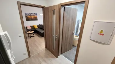 a door to a room with a living room at Apartmán Trilobit in Beroun