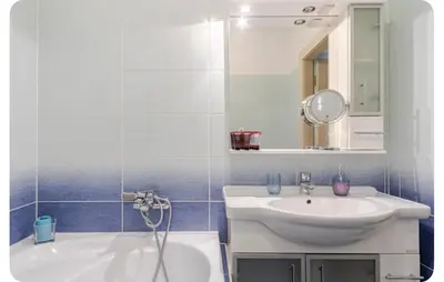 a bathroom with a sink and a tub and a mirror at Apartmán l Praha centrum in Prague