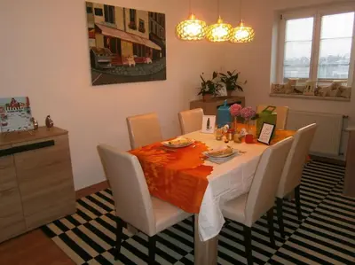 a dining room table with white chairs and a dining room at Harrison Homes Prague Apartment 01 Terrace and Parking in Prague