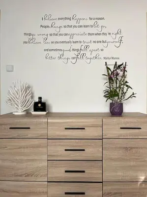 a dresser with writing on a white wall at Harrison Homes Prague Apartment 01 Terrace and Parking in Prague
