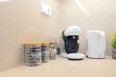 a coffee maker sitting on top of a counter at Design Apartment - Balcony, Free Parking, Yoga, 10 mins to center, by Gravity Prague in Prague
