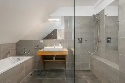 a bathroom with a sink and a shower at ROY 2 bdr Apartment with Prague Castle View, Parking & AC in Prague