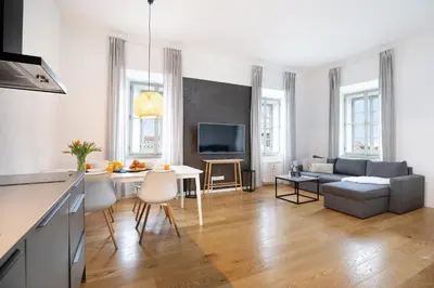 a living room with a table and a couch at U Zlaté hvězdy Kalich in Litoměřice