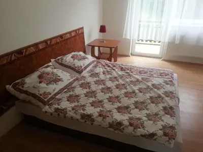 a bed with a quilt on it in a bedroom at Holiday home in Krivoklat 1156 in Křivoklát