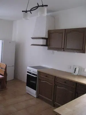 a kitchen with a white stove and a refrigerator at Holiday home in Krivoklat 1156 in Křivoklát