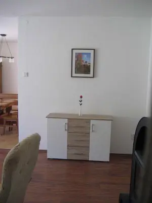 a living room with a table with a flower on it at Holiday home in Krivoklat 1156 in Křivoklát