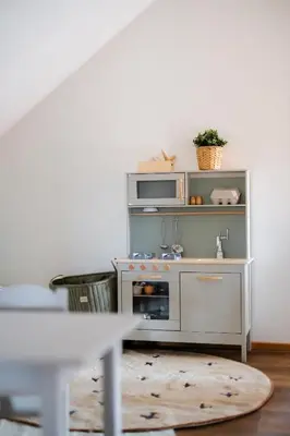 a kitchen with a microwave and a stove at Domeček v Chaloupkách in Zdice