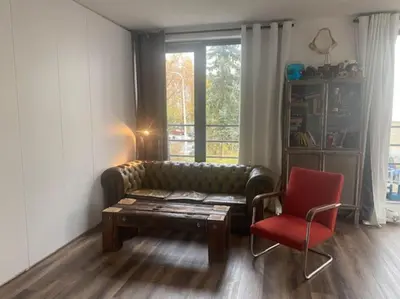 a screened in porch with sliding glass doors at Apartment Big Windows in Prague
