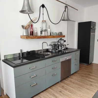 a kitchen with a sink and a counter at Apartment Big Windows in Prague