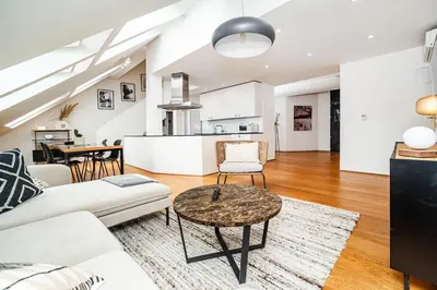 a living room with a couch and a table at Luxurious 3bed very spacious apt in the best area in Prague